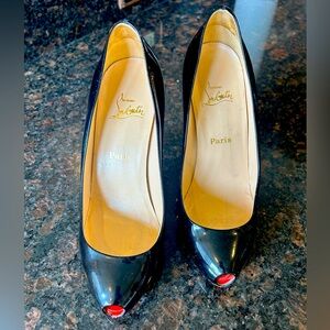 Patent leather Christian Louboutin shoes.